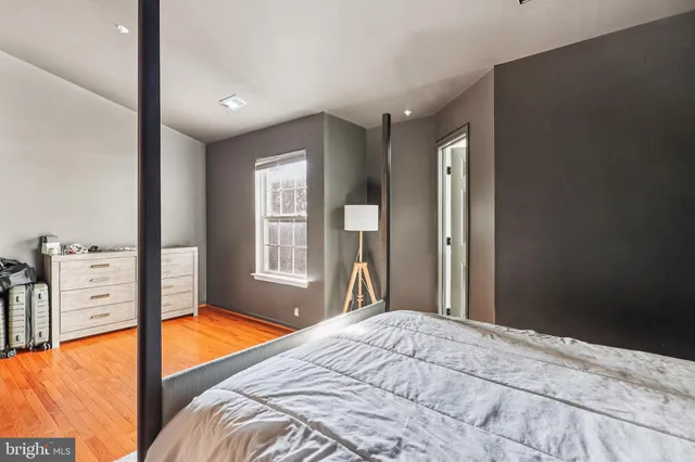 a view of a bedroom with a large bed and balcony