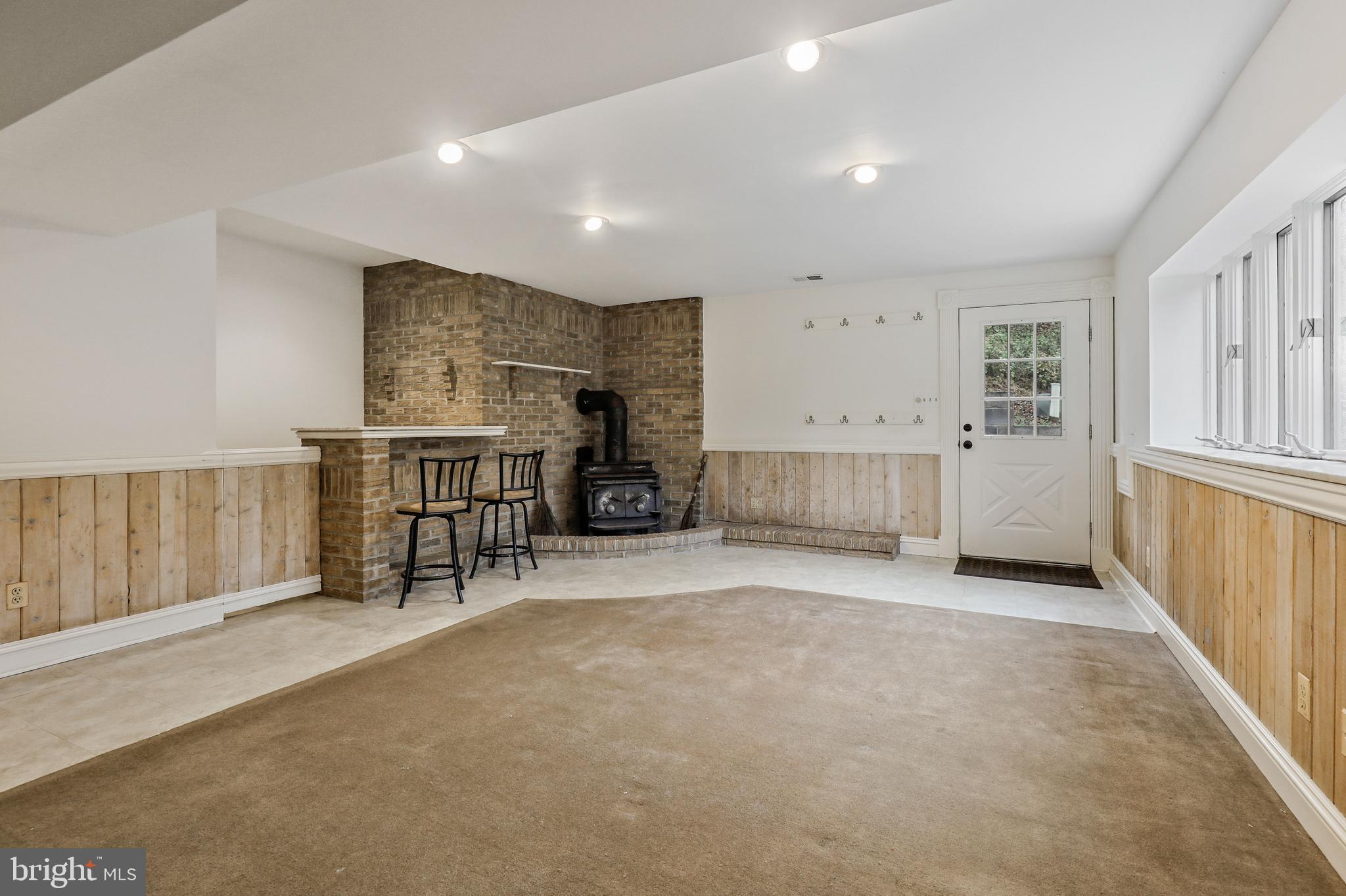 7658 Gaither Road Sykesville, MD 21784 - Photo 33 of 44 Basement with bar & wood stove