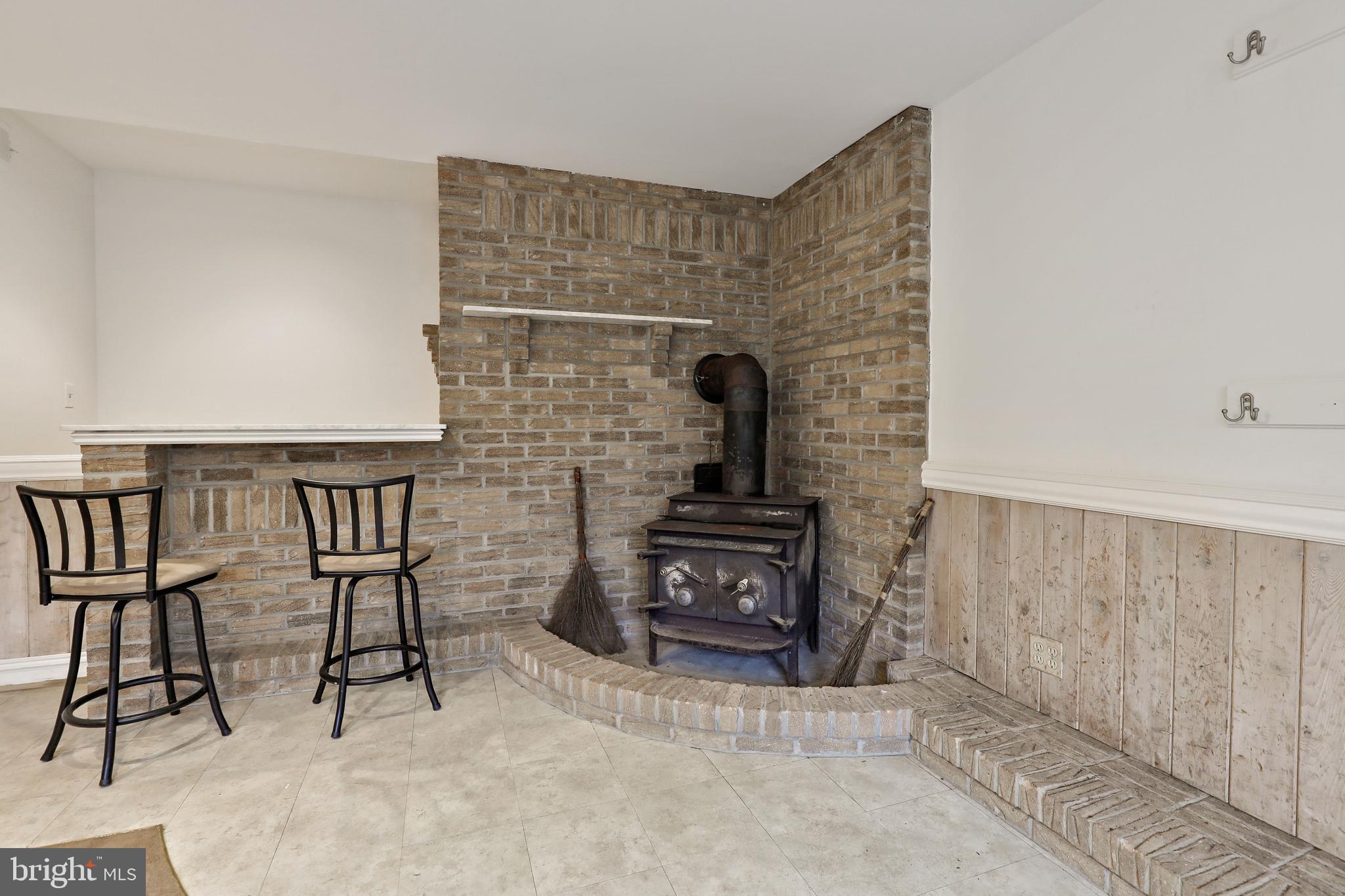 7658 Gaither Road Sykesville, MD 21784 - Photo 36 of 44 Wood stove in the basement