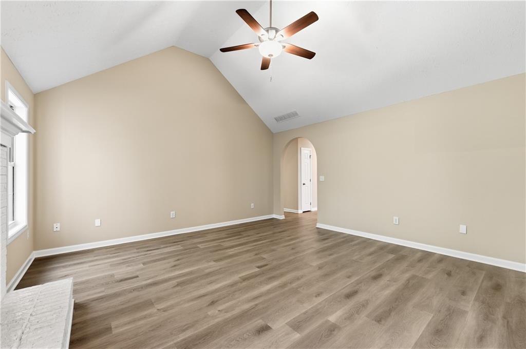 1730 Alcovy River Drive Dacula, GA 30019 - Photo 11 of 30 a view of an empty room with window and a ceiling fan
