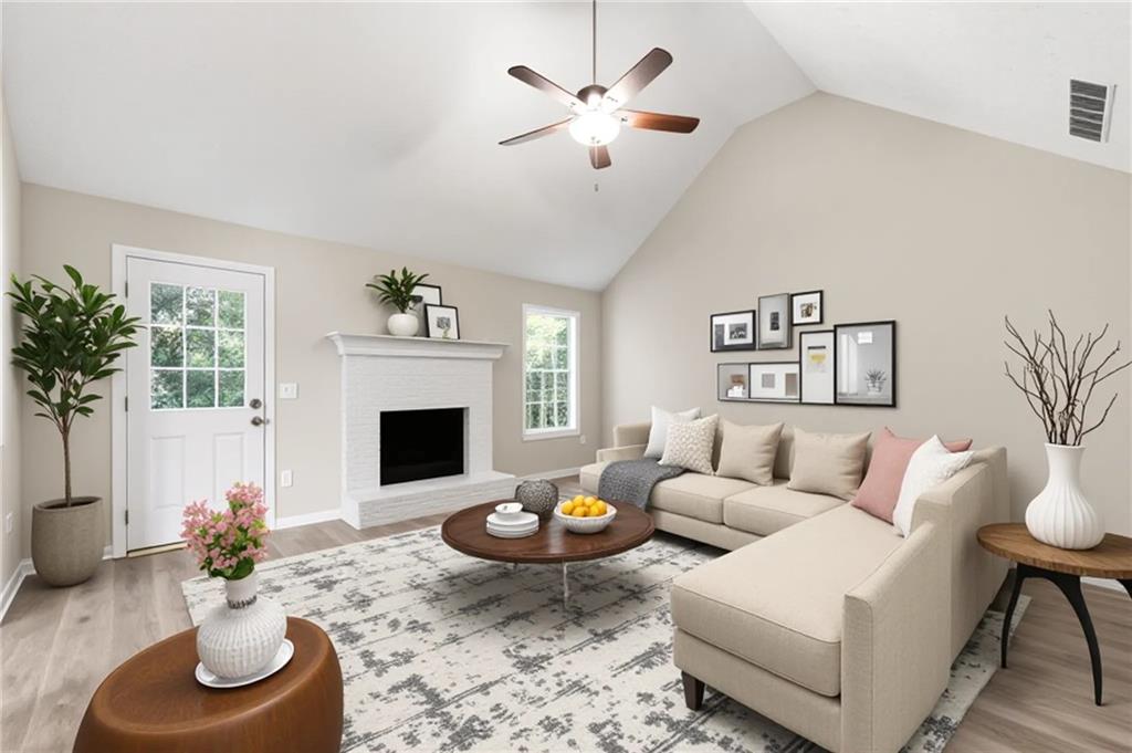 1730 Alcovy River Drive Dacula, GA 30019 - Photo 13 of 30 a living room with furniture and a fireplace