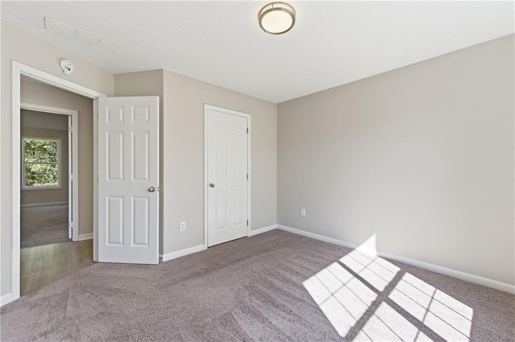 1730 Alcovy River Drive Dacula, GA 30019 - Photo 17 of 30 an empty room with windows