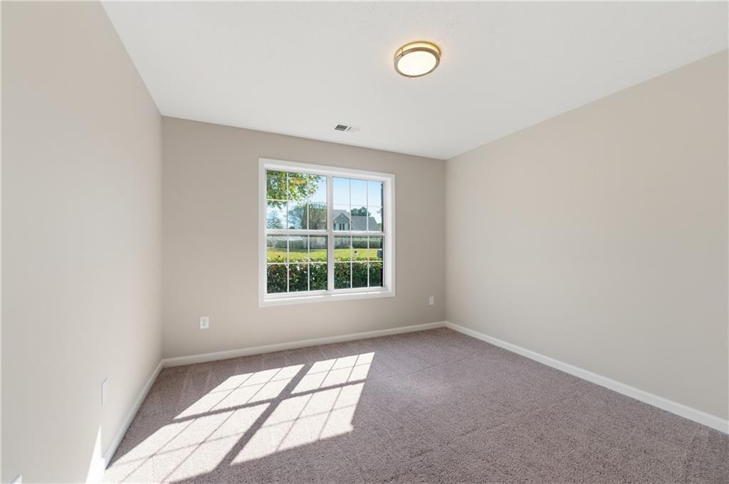 1730 Alcovy River Drive Dacula, GA 30019 - Photo 25 of 30 an empty room with a window