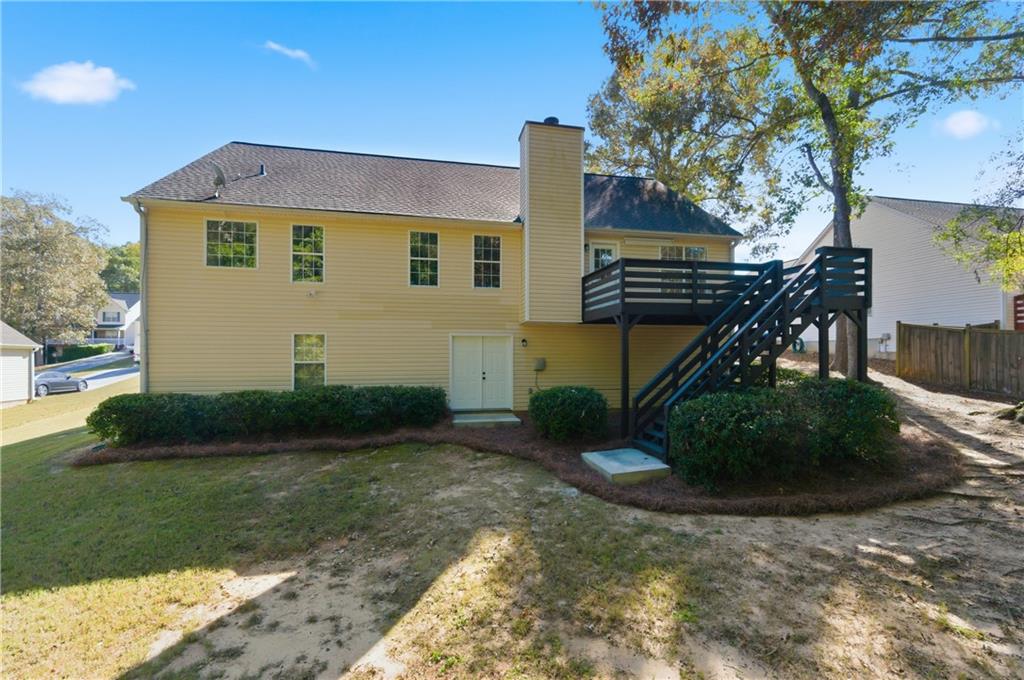 1730 Alcovy River Drive Dacula, GA 30019 - Photo 30 of 30 a front view of a house with garden