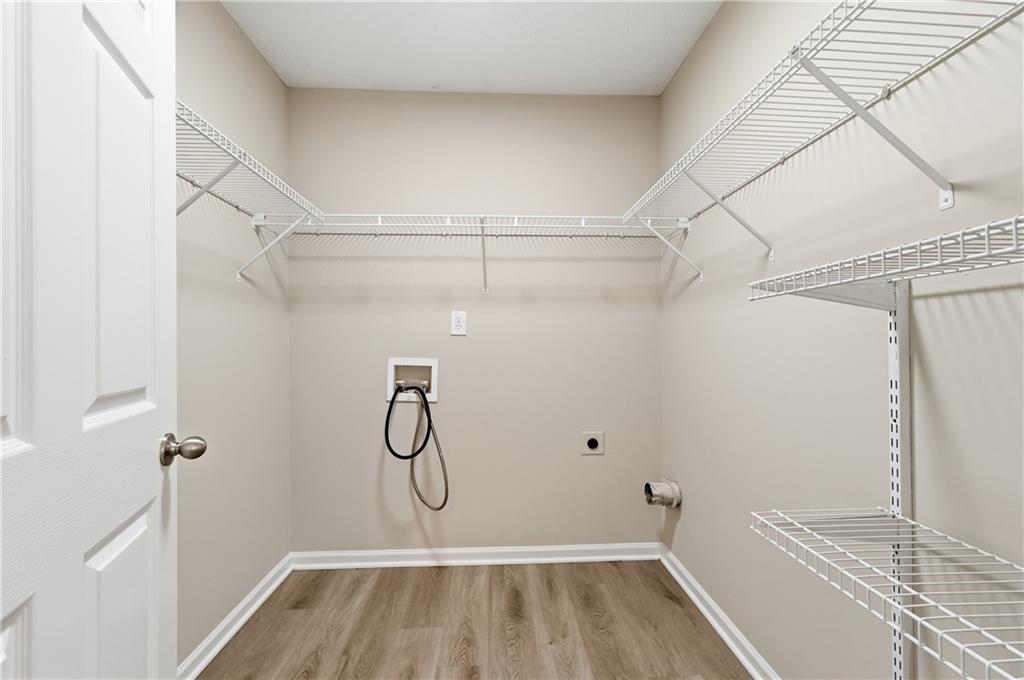 1730 Alcovy River Drive Dacula, GA 30019 - Photo 7 of 30 a bathroom with a glass shower door