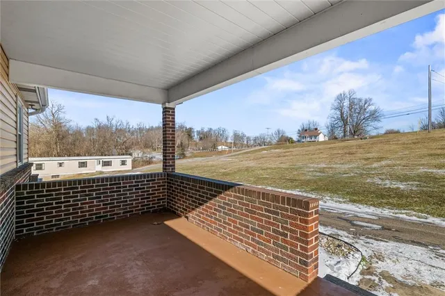 a view of a balcony with an ocean view