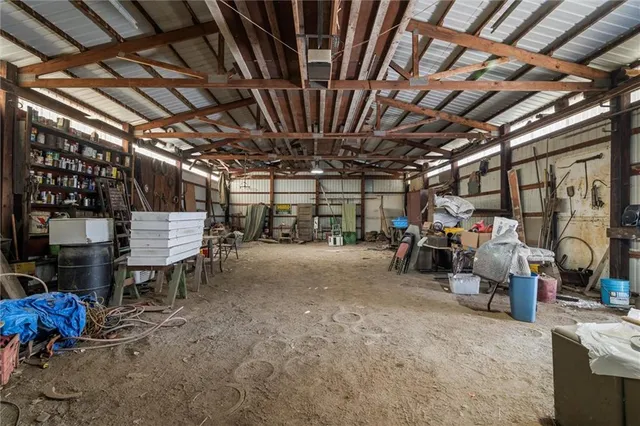 a view of empty room with wooden ceiling