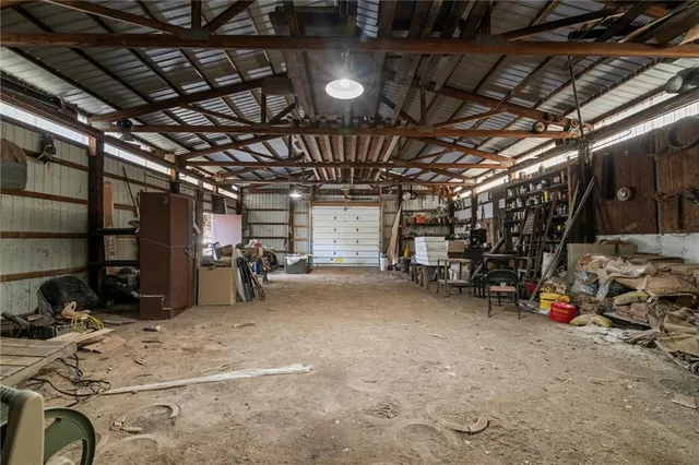 a view of a house with a yard covered in snow