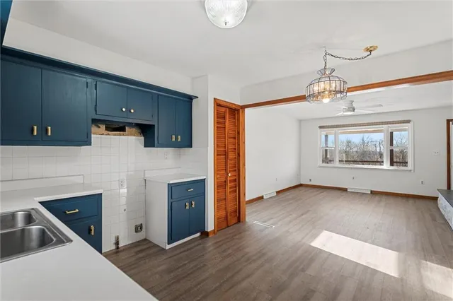 a view of a kitchen with an oven and a refrigerator