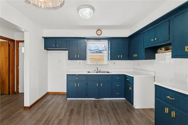 a spacious bathroom with a sink and a mirror