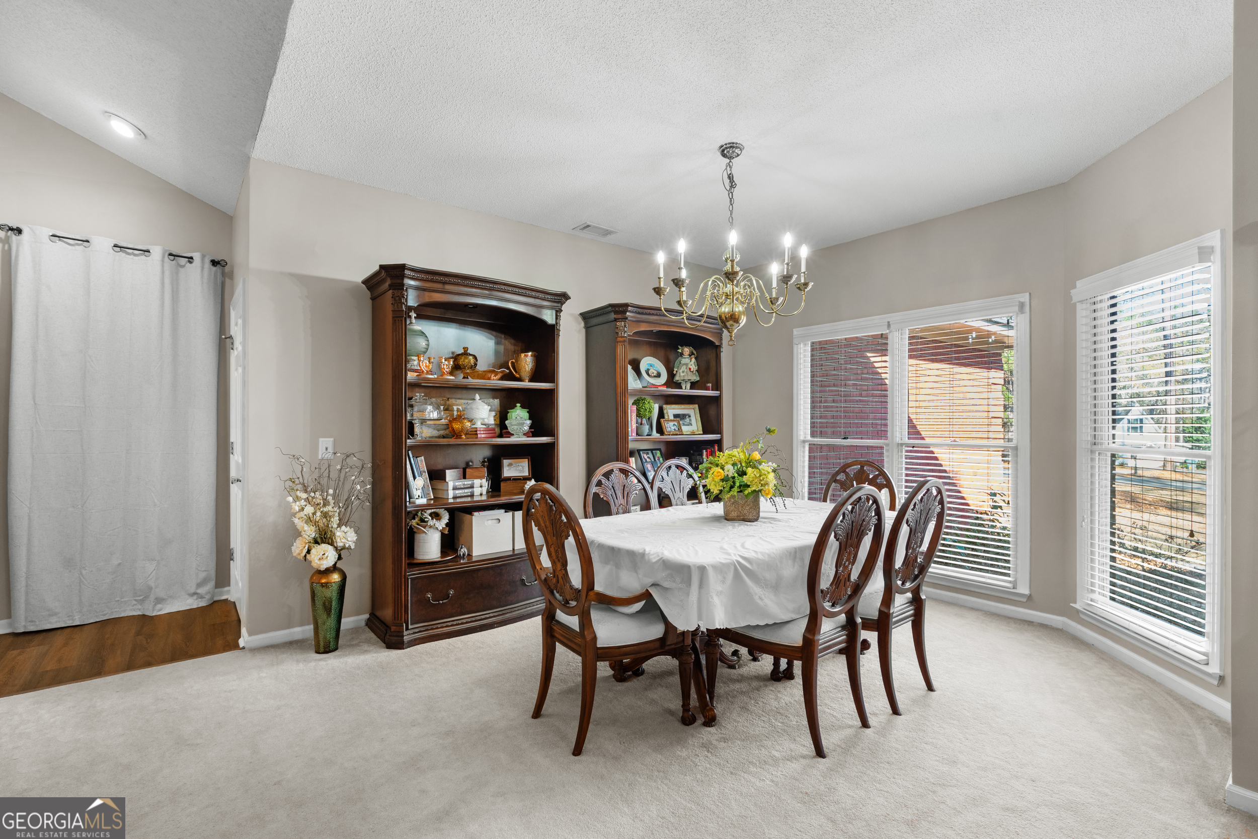 1018 Hunters Pointe Drive Statesboro, GA 30461 - Photo 11 of 21 a view of a dining room with furniture and window