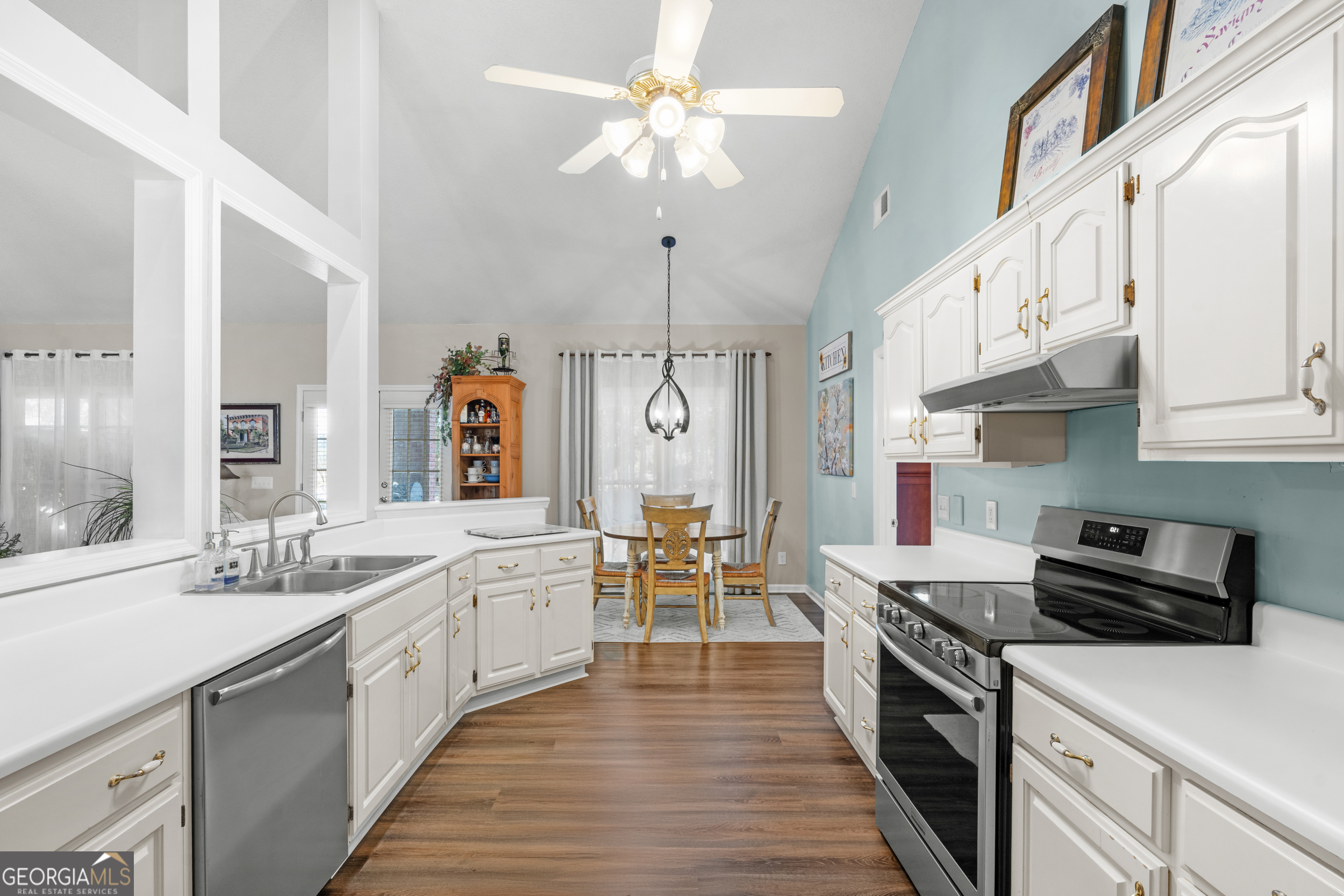 1018 Hunters Pointe Drive Statesboro, GA 30461 - Photo 10 of 21 a large kitchen with stainless steel appliances a stove center island a dining table and chairs