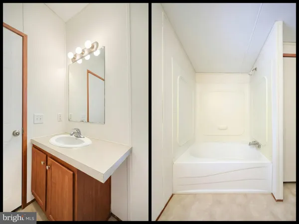 a white bath tub sitting next to a toilet