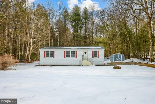 a view of a backyard of the house