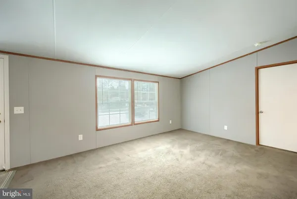 a kitchen with a sink cabinets and window