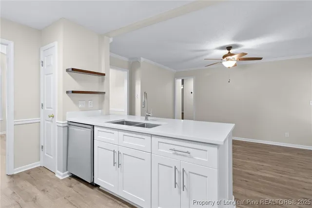 wooden floor fireplace and windows in an empty room