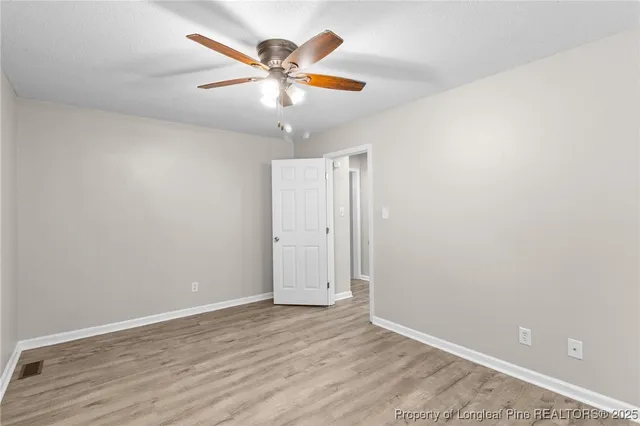 a bathroom with a sink vanity and a mirror