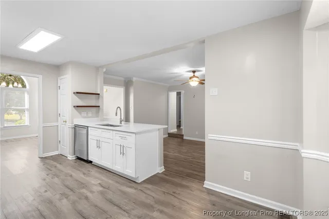 a kitchen with a sink stove and refrigerator
