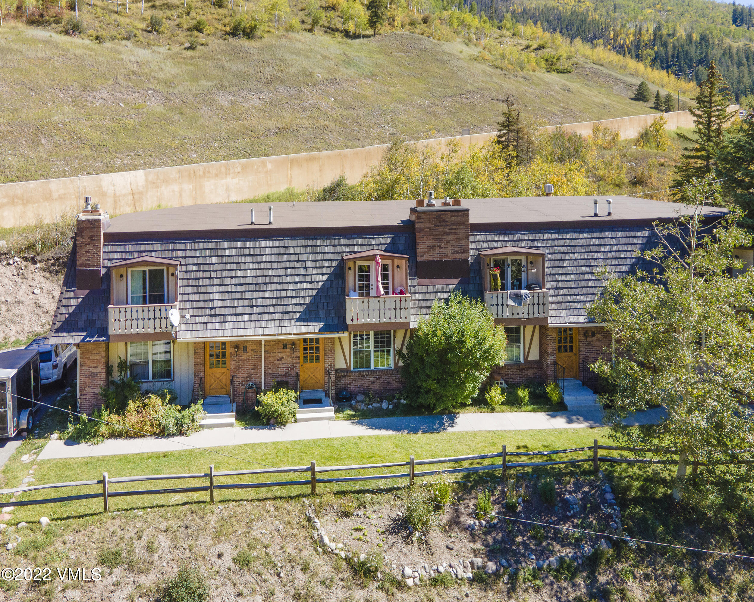 a front view of house with a garden