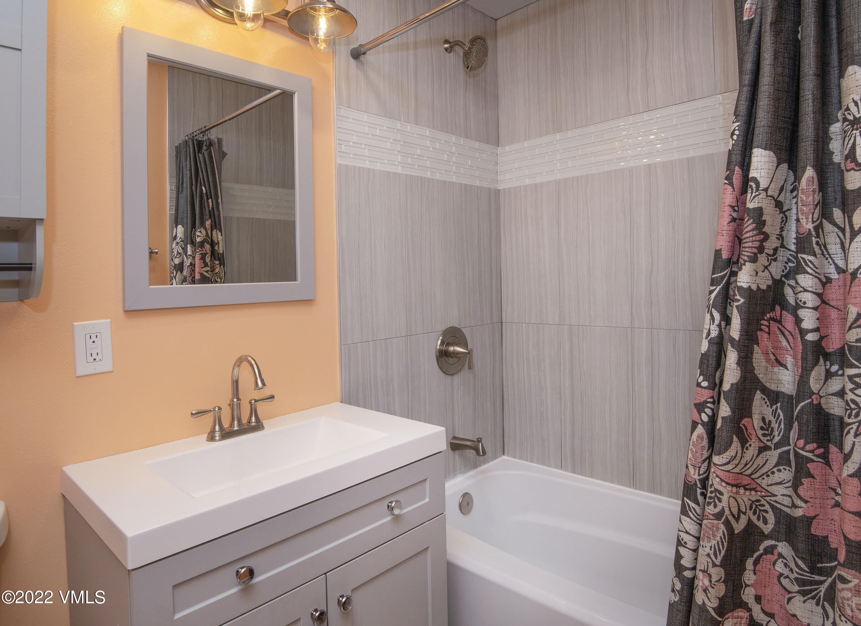 4073 Spruce Way, Unit 22 Vail, CO 81657 - Photo 12 of 25 a bathroom with a sink a toilet and a bathtub