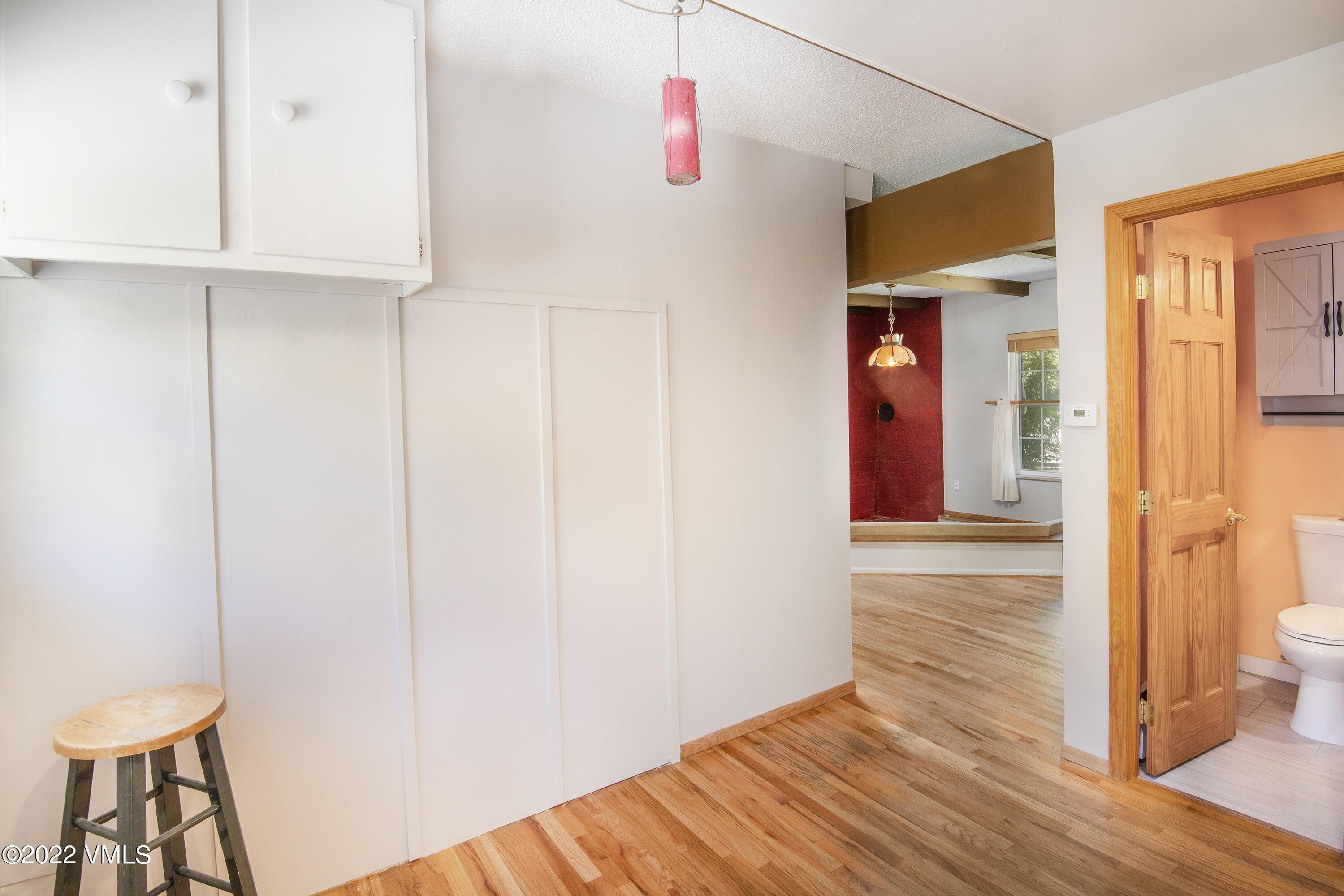 4073 Spruce Way, Unit 22 Vail, CO 81657 - Photo 13 of 25 wooden floor in an empty room