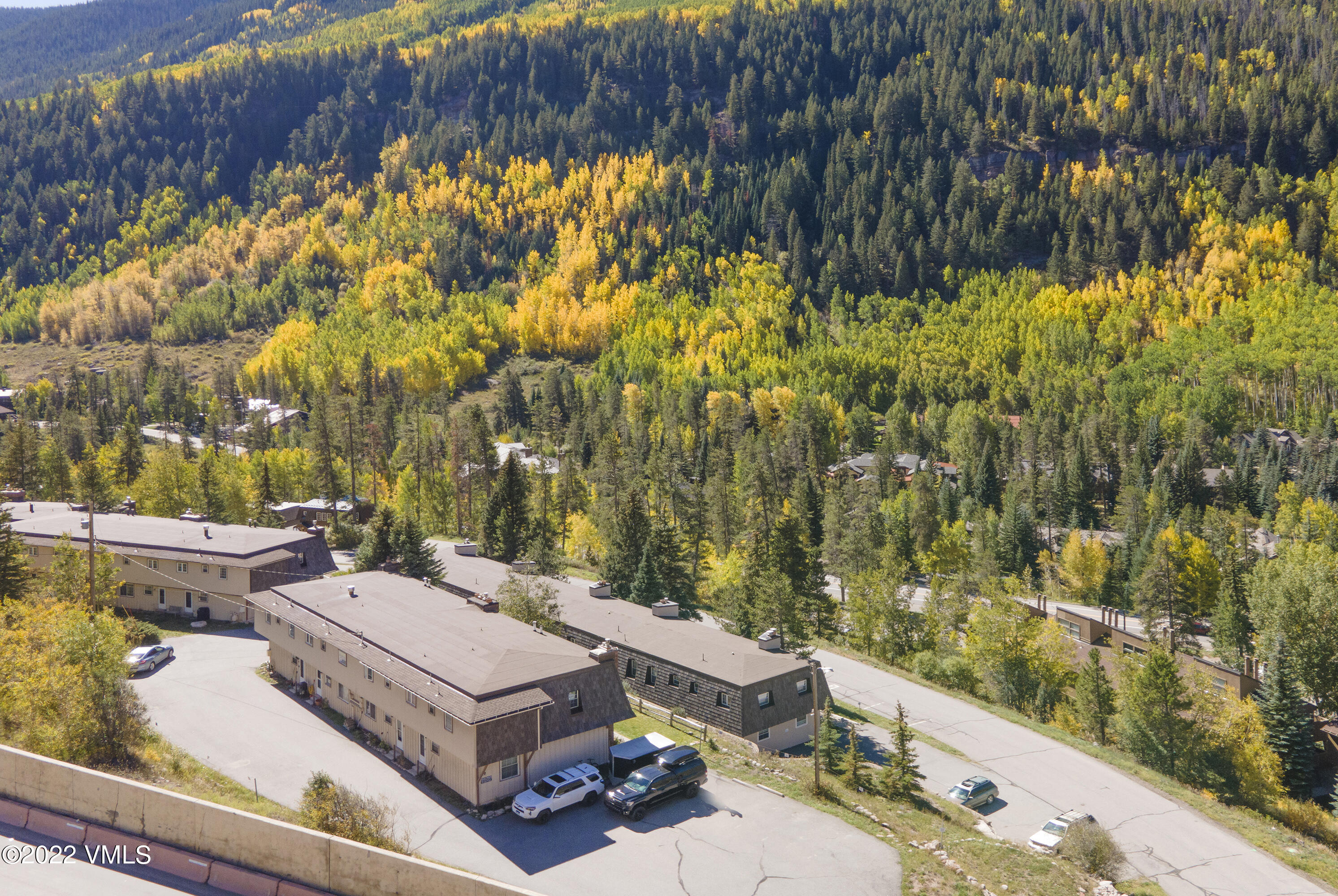 4073 Spruce Way, Unit 22 Vail, CO 81657 - Photo 22 of 25 a view of a backyard with swimming pool of the house