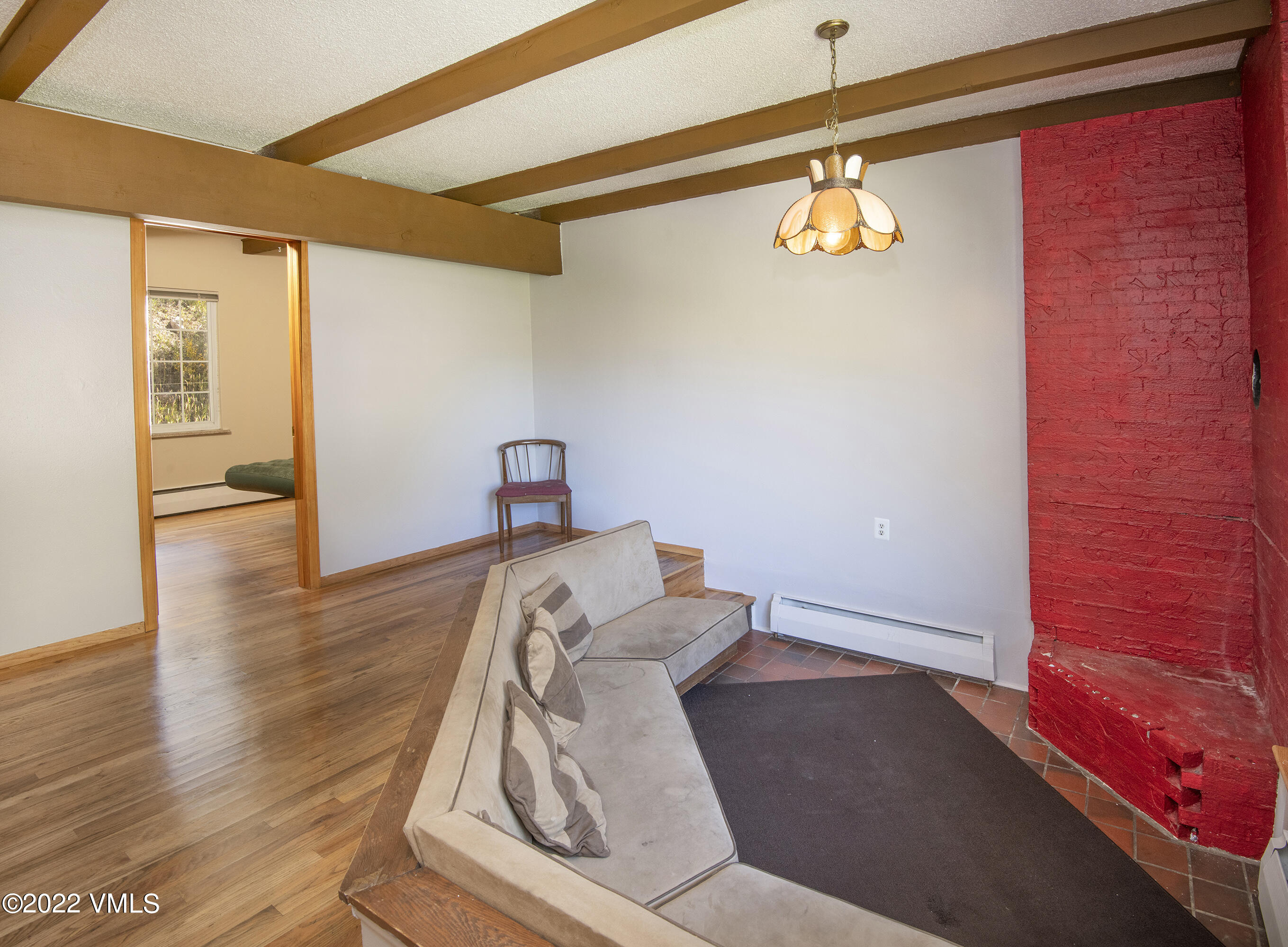 4073 Spruce Way, Unit 22 Vail, CO 81657 - Photo 4 of 25 a view of a livingroom with wooden floor