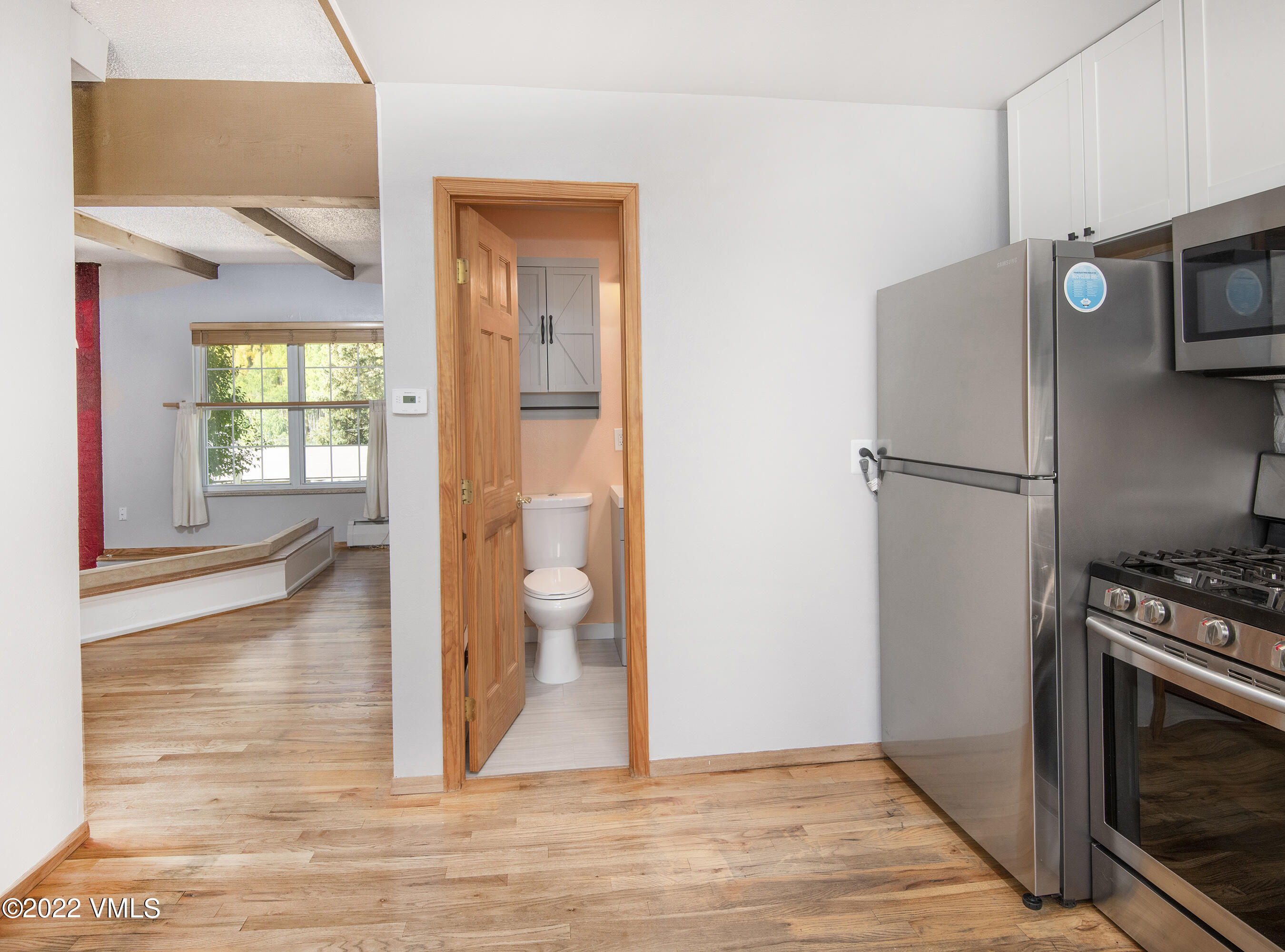 4073 Spruce Way, Unit 22 Vail, CO 81657 - Photo 9 of 25 a kitchen with a refrigerator and a stove top oven