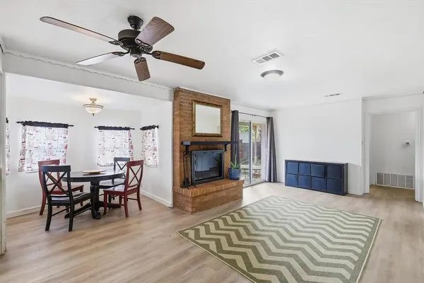 a bedroom with furniture and a fireplace
