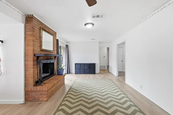 a bedroom with a bed and a fireplace