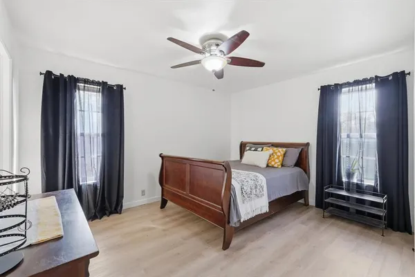 a bed room with a bed and a window