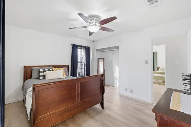 a room with a bed and a chandelier