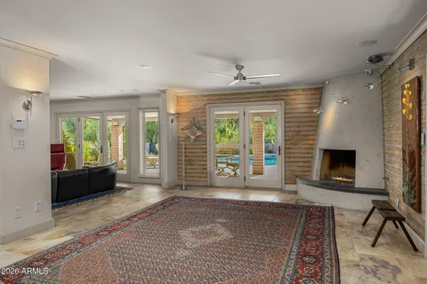 a living room with furniture windows and a fireplace