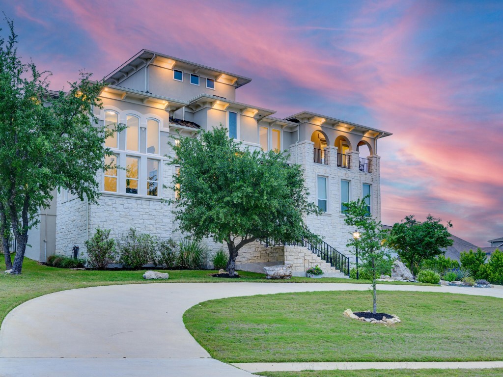 310 Lodestone Lane Lakeway, TX 78738 - Photo 1 of 1 a front view of a multi story building with yard