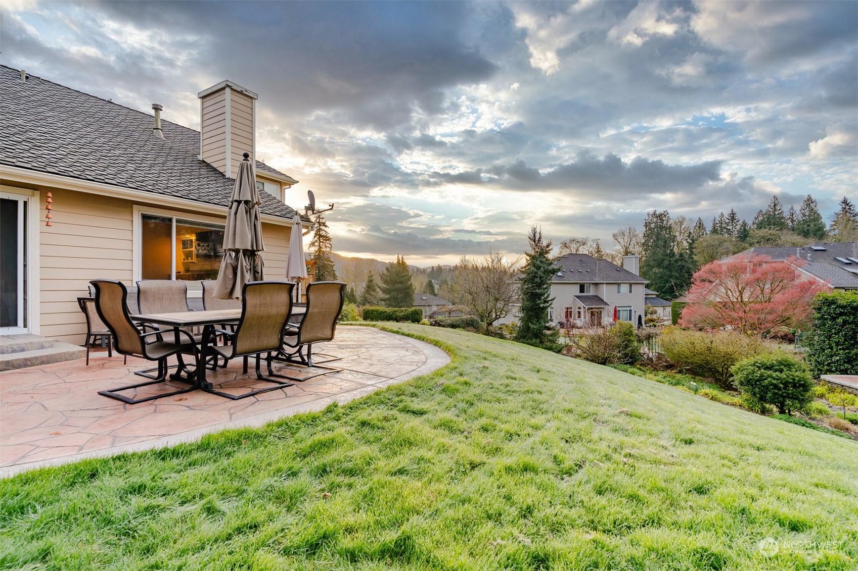 15935 Southeast 124th Place Renton, WA 98059 - Photo 3 of 40 a view of a backyard with table and chairs and a fire pit