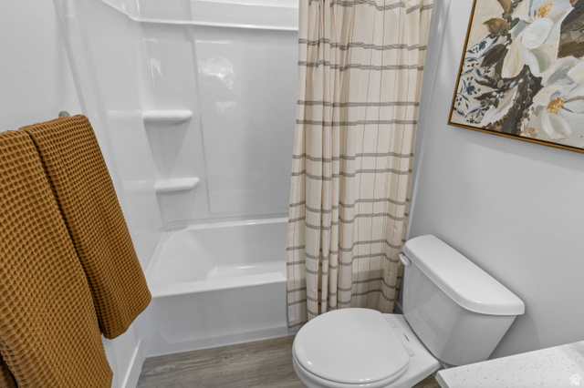 1264 West 500 South, Unit 320 Logan, UT 84321 - Photo 30 of 39 White fiberglass tub and shower combination with integrated shelving