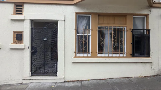 a utility room with stainless steel appliances and cabinets
