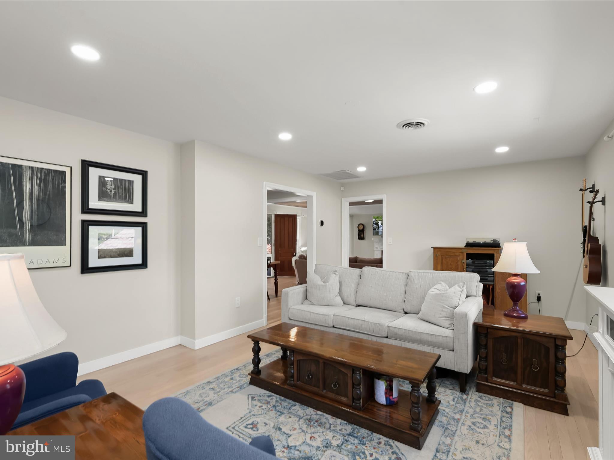 17712 Longdraft Road Gaithersburg, MD 20878 - Photo 14 of 85 a living room with furniture a rug and a window
