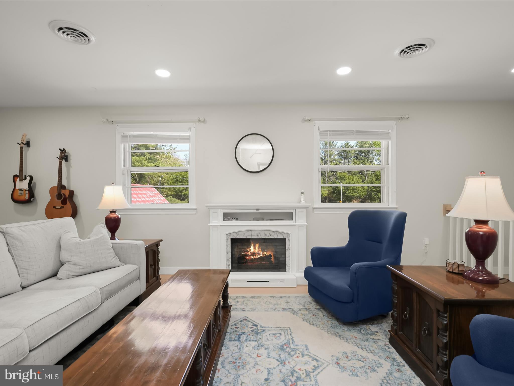 17712 Longdraft Road Gaithersburg, MD 20878 - Photo 15 of 85 a living room with furniture a fireplace and a large window