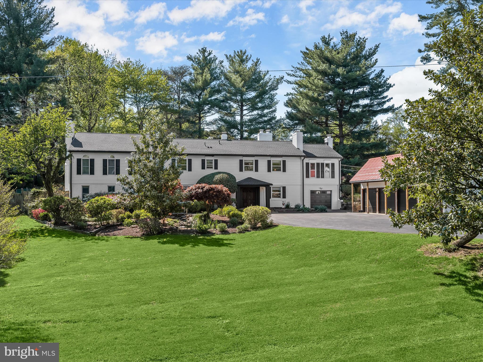 17712 Longdraft Road Gaithersburg, MD 20878 - Photo 2 of 85 a view of a house with a yard and sitting area