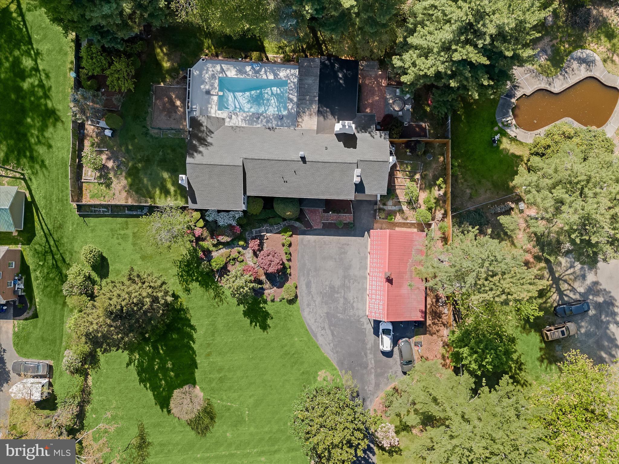 17712 Longdraft Road Gaithersburg, MD 20878 - Photo 4 of 85 an aerial view of a house with a yard and garden