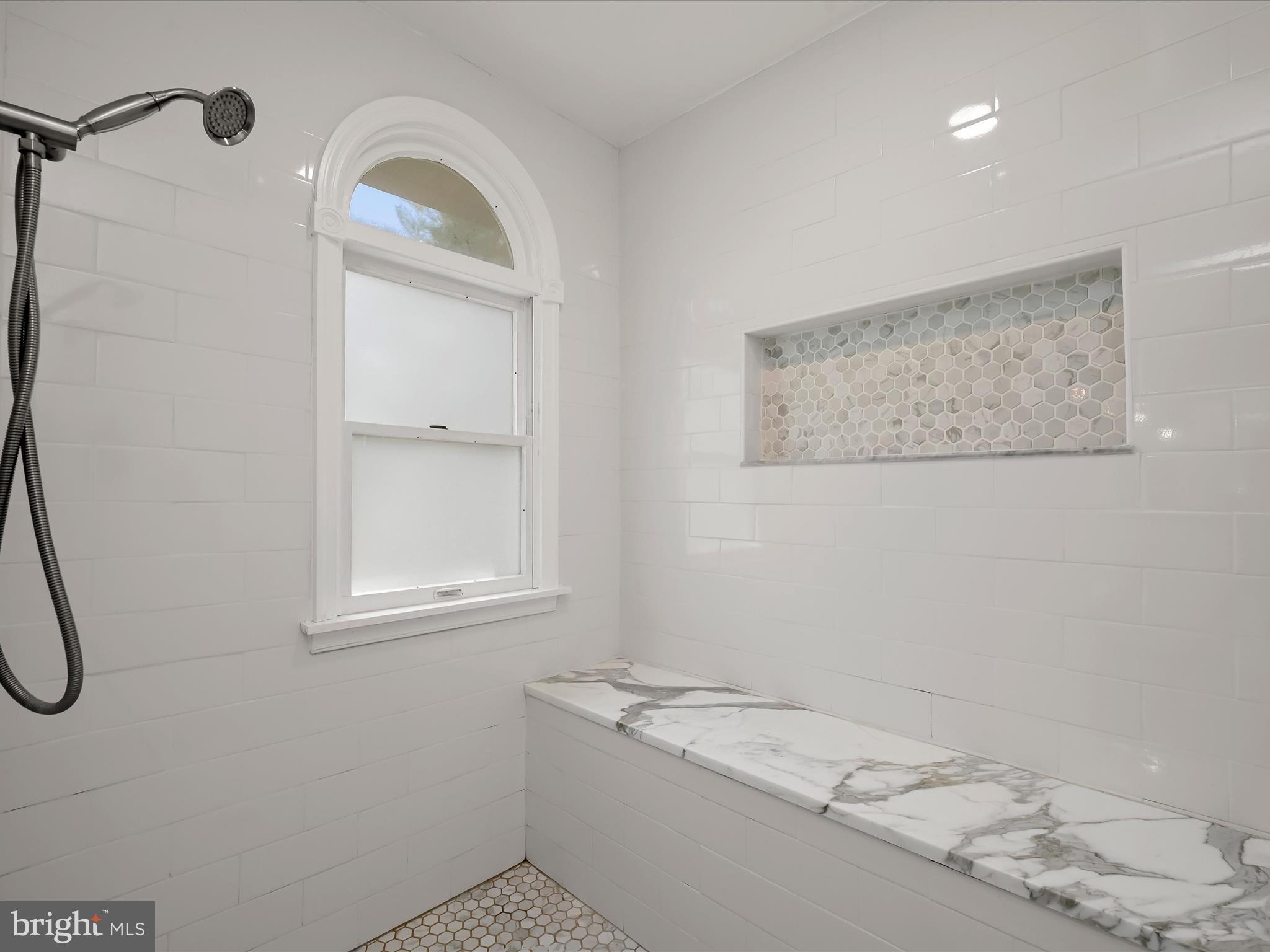17712 Longdraft Road Gaithersburg, MD 20878 - Photo 44 of 85 a bathroom with a granite countertop sink and a window