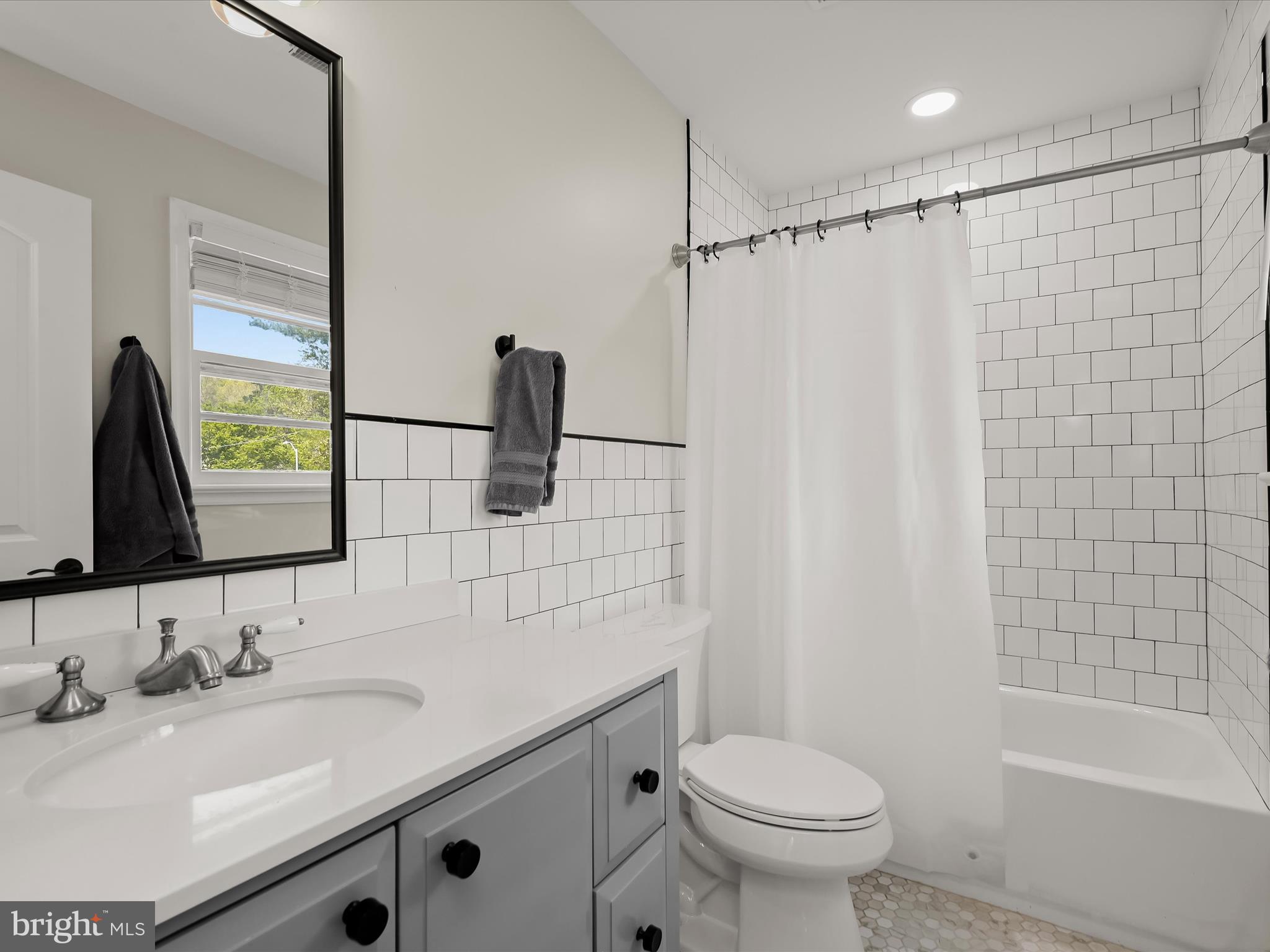 17712 Longdraft Road Gaithersburg, MD 20878 - Photo 50 of 85 a bathroom with a sink toilet and shower