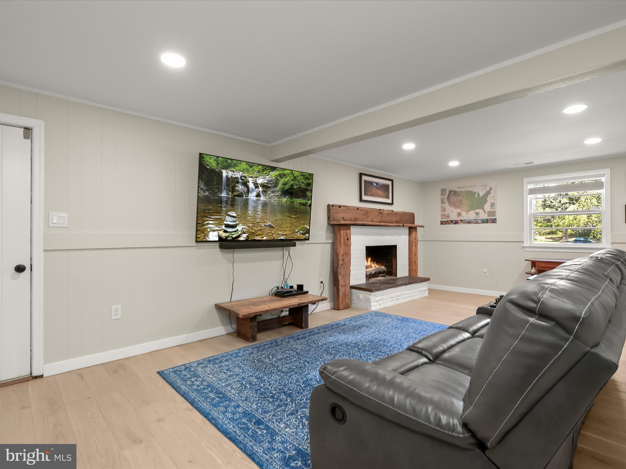 17712 Longdraft Road Gaithersburg, MD 20878 - Photo 58 of 85 a living room with furniture and a fireplace