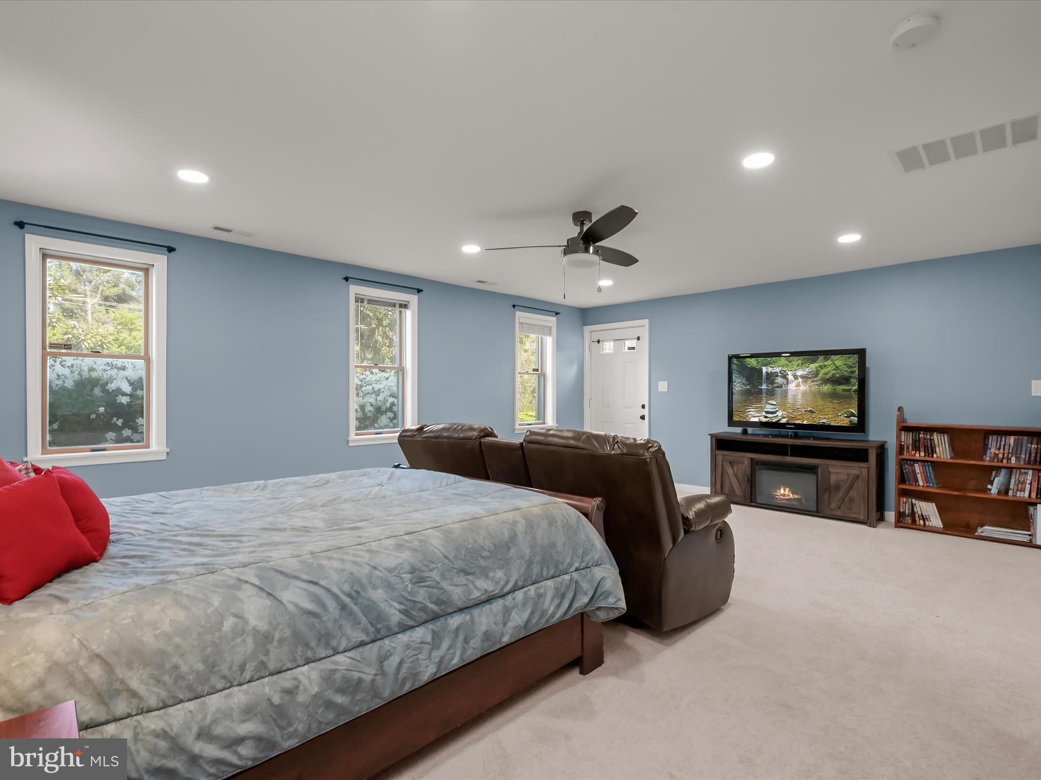 17712 Longdraft Road Gaithersburg, MD 20878 - Photo 64 of 85 a bedroom with a large bed and a flat screen tv