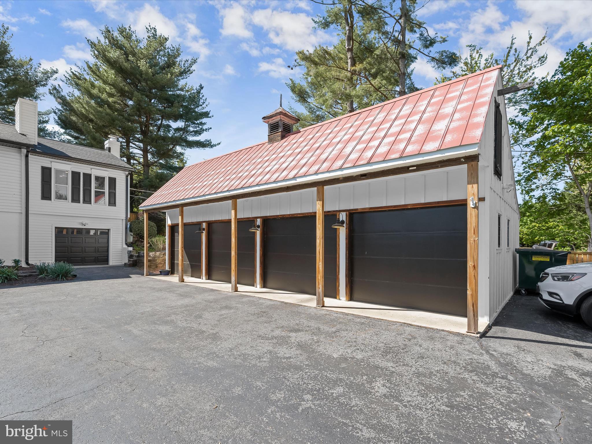 17712 Longdraft Road Gaithersburg, MD 20878 - Photo 8 of 85 a front view of a house with a garden and garage