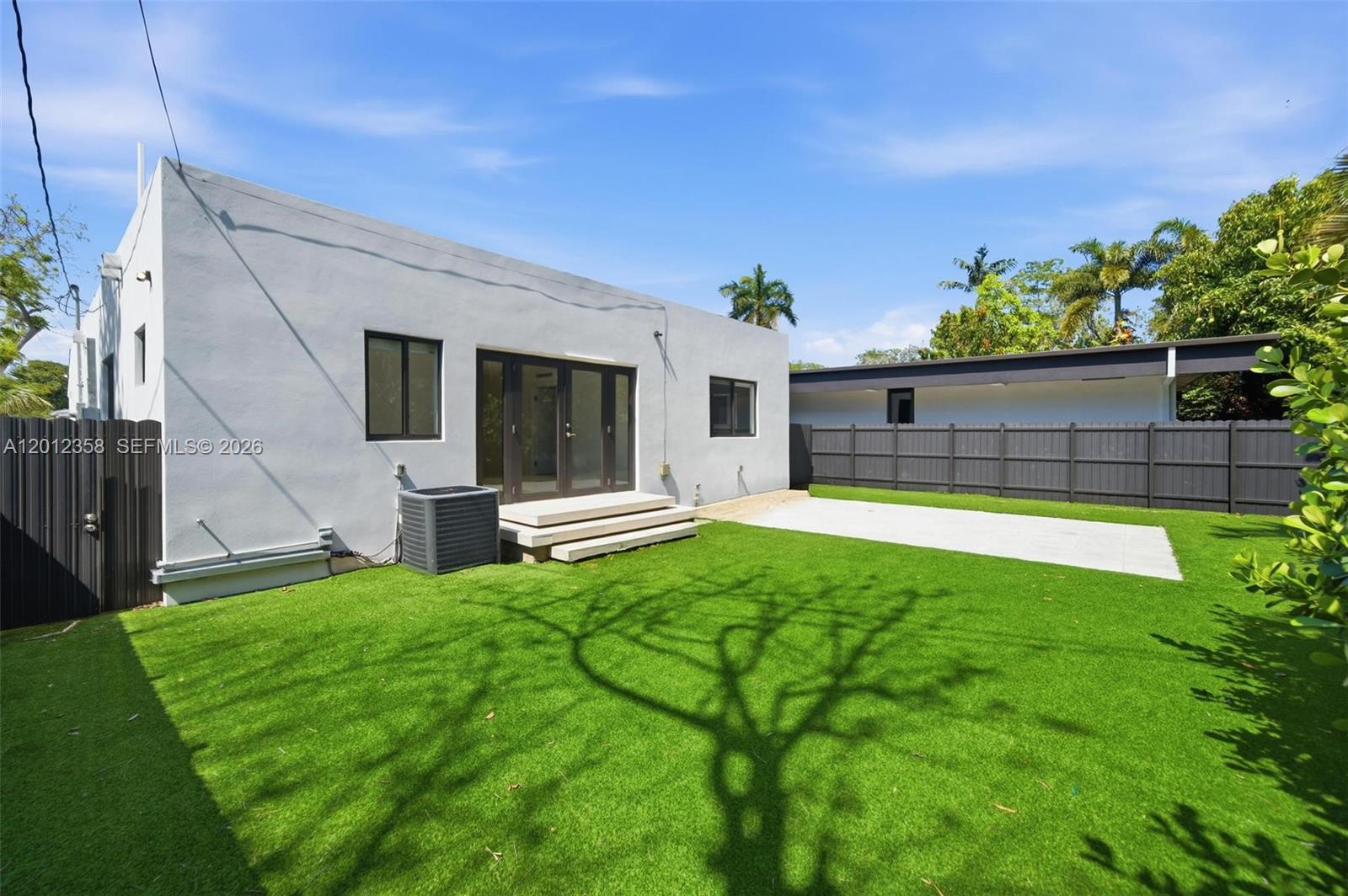 120 Northeast 49th Street Miami, FL 33137 - Photo 30 of 34 a view of backyard with a garden and deck