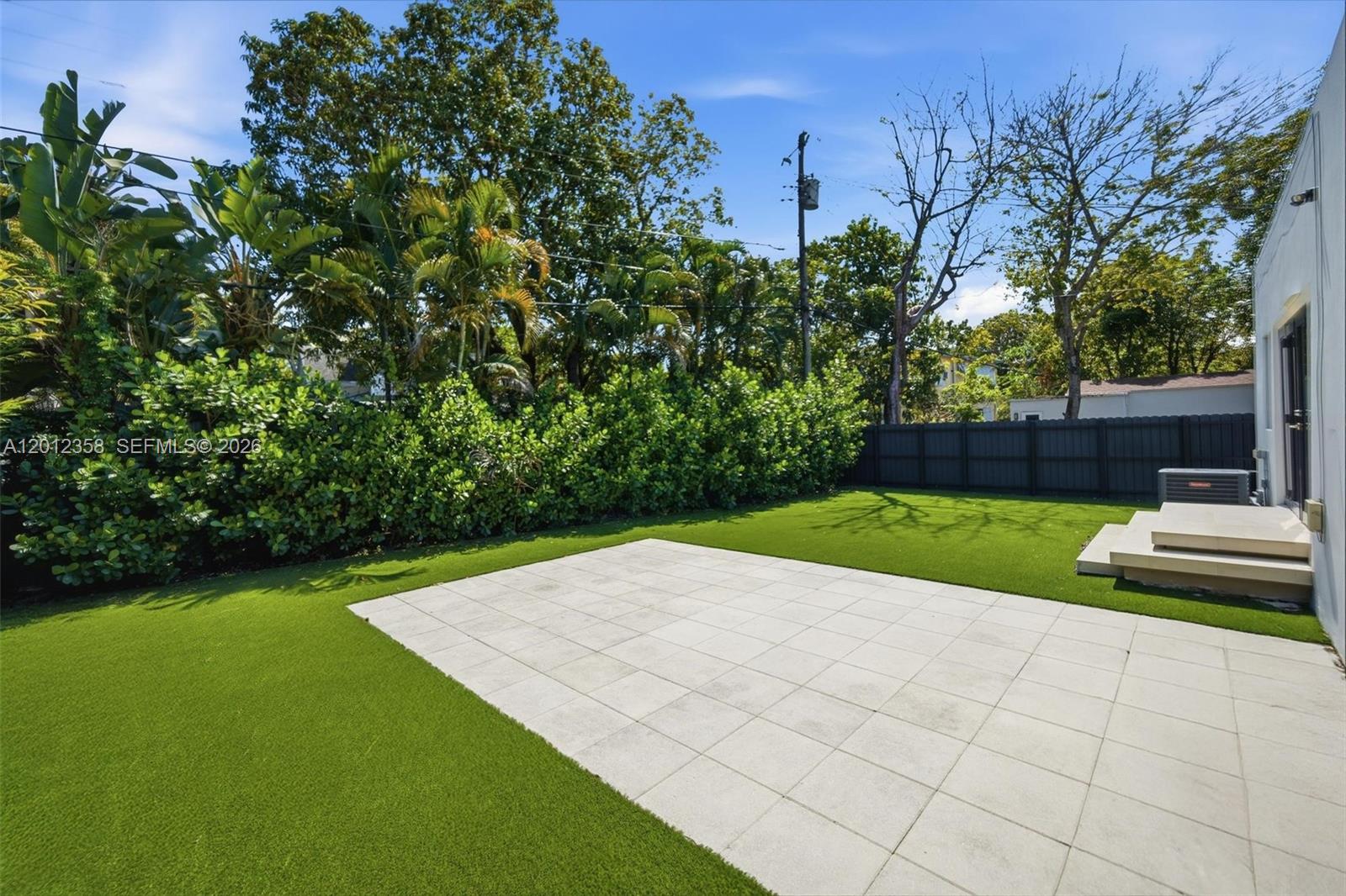 120 Northeast 49th Street Miami, FL 33137 - Photo 3 of 34 a view of backyard with seating and green space