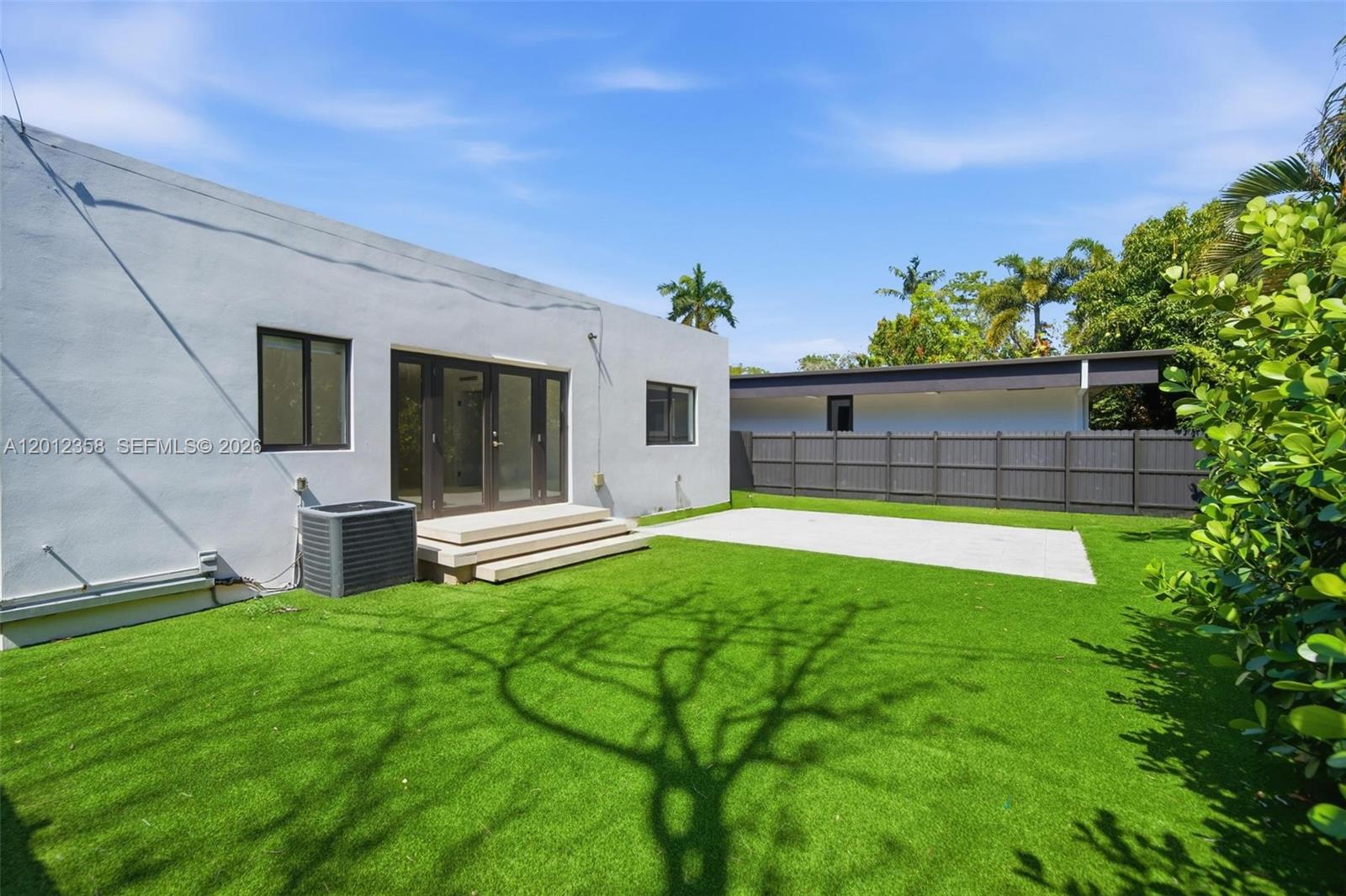 120 Northeast 49th Street Miami, FL 33137 - Photo 31 of 34 a view of house with backyard and a tub