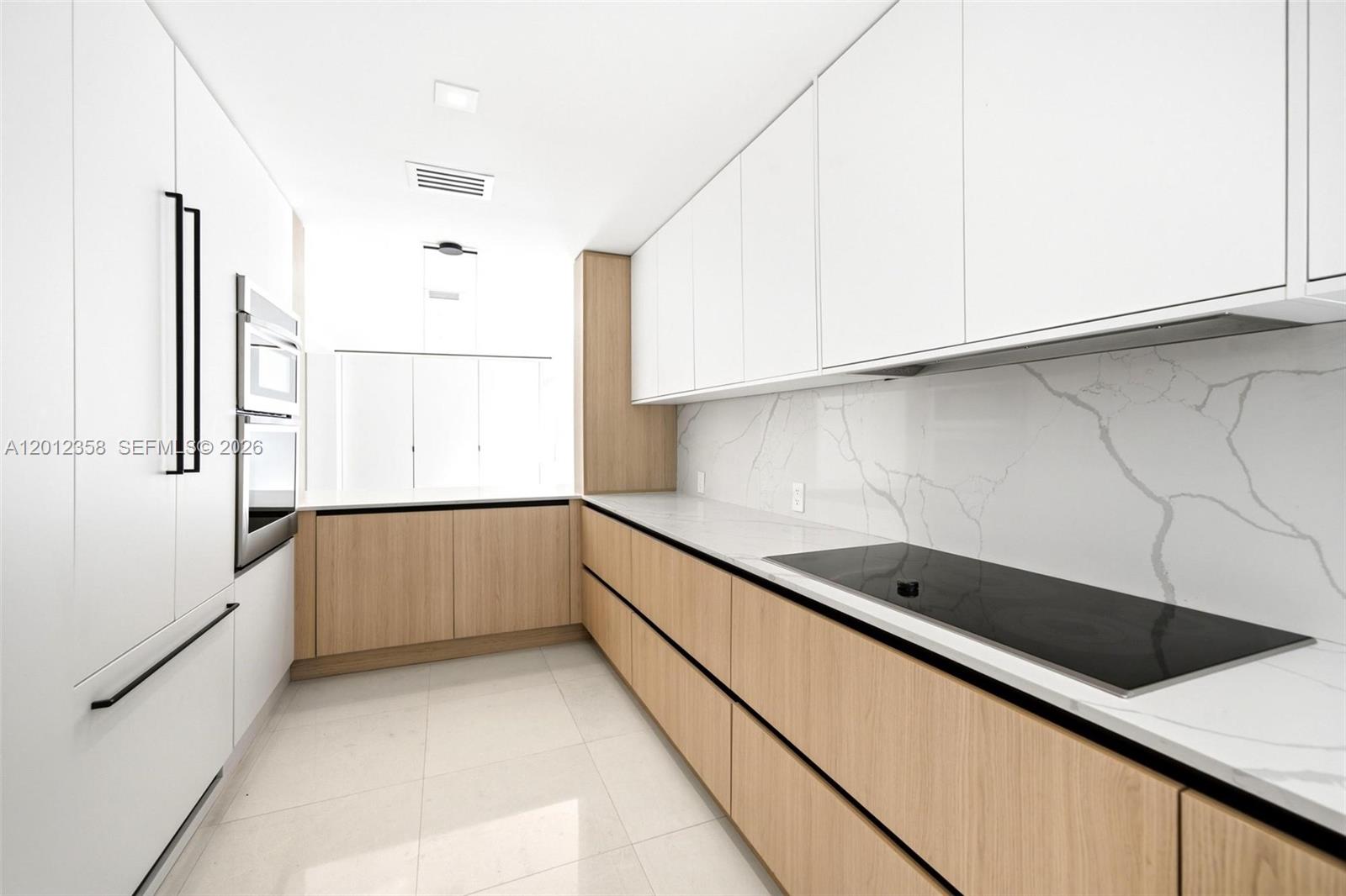 120 Northeast 49th Street Miami, FL 33137 - Photo 10 of 34 a kitchen with a sink and cabinets
